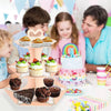 A 3-tier rainbow cupcake stand displaying various cupcakes and desserts for a party display.