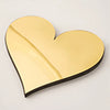A gold acrylic mirror heart shape wall sticker for decorative purposes.