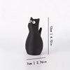A black cat-shaped table vase with a playful design shown against a white background.