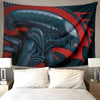 A dark blue alien head design on a red background, used as a tapestry wall hanging.