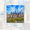 A magnet featuring a scenic view of the Philadelphia skyline under a blue sky.