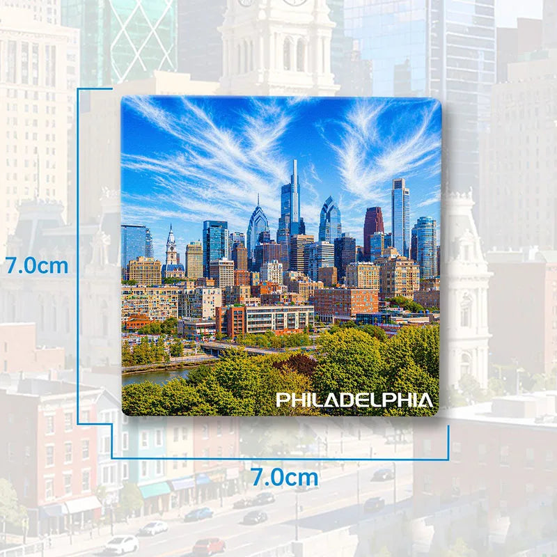 A magnet featuring a scenic view of the Philadelphia skyline under a blue sky.