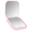 A pink compact portable vanity mirror with a rectangular reflective surface.
