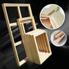 Wooden frame and canvas art display featuring various wood planks and a framed piece.