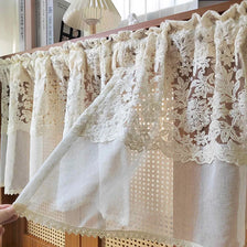 Beige sheer curtain featuring delicate floral embroidery and lace trim.
