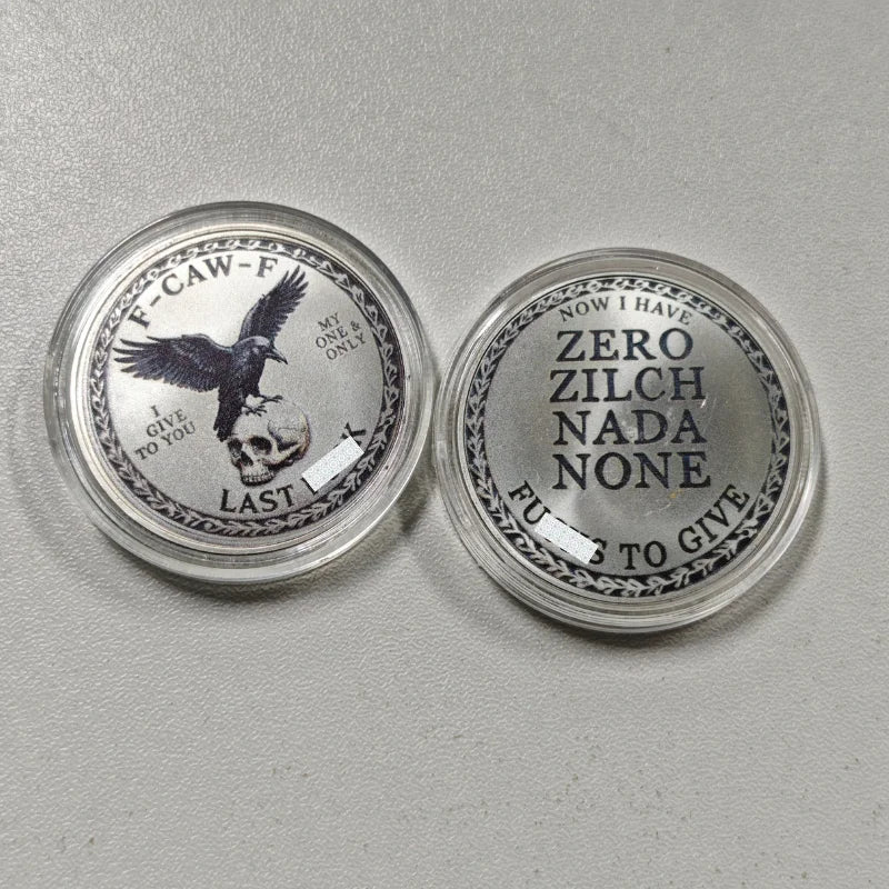 Two silver challenge coins featuring a crow and skull design, labeled with text like Now I Have Zero Zilch Nada None and Last