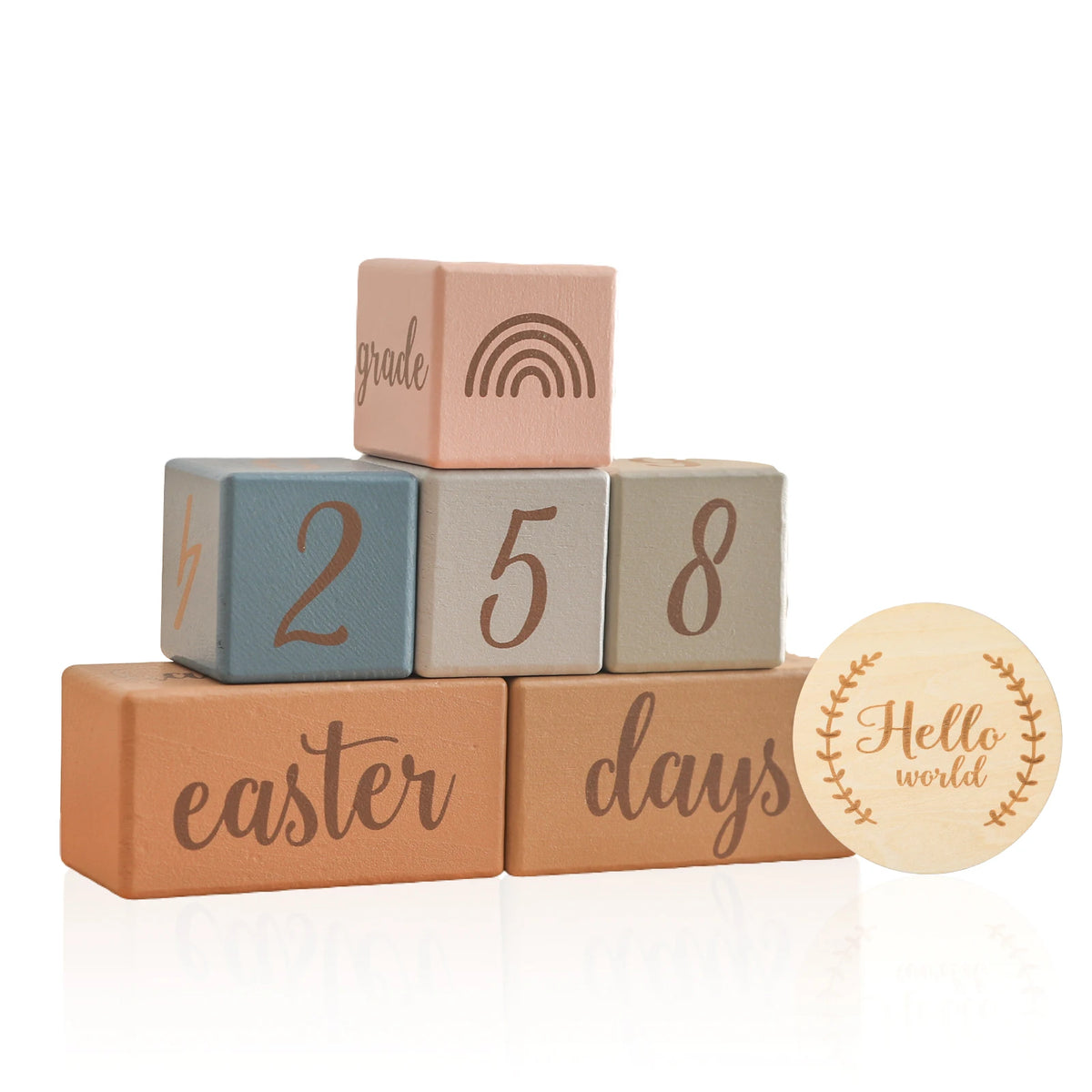 A stack of wooden baby milestone cards showing the numbers 2, 5, and 8 with an Easter theme.