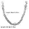 Silver paperclip chain bag strap with a lobster clasp and oval charm, measuring 38cm long.
