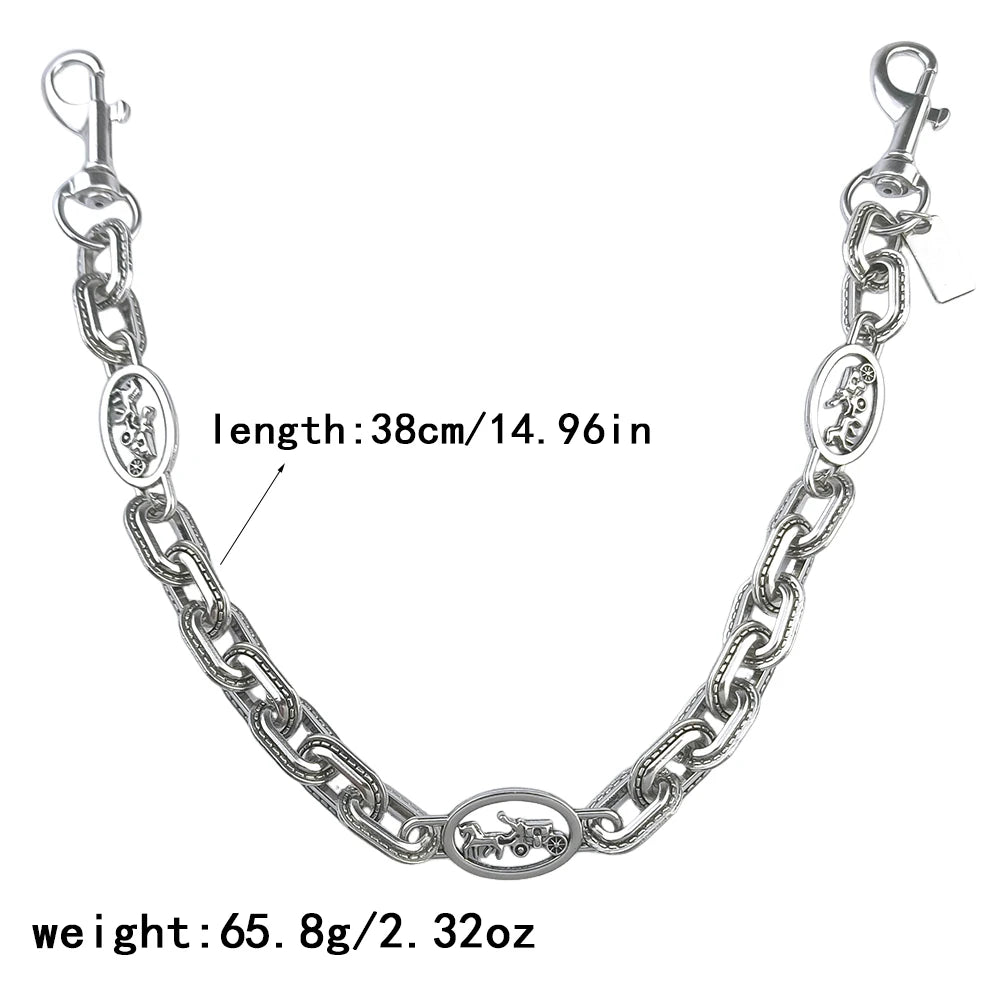 Silver paperclip chain bag strap with a lobster clasp and oval charm, measuring 38cm long.