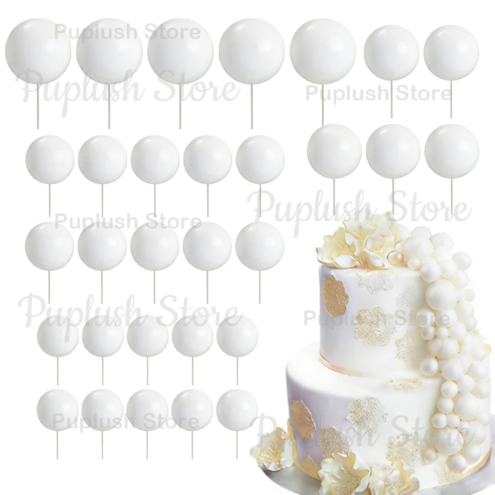 A set of white foam cake toppers, including various sized round and petal shapes, displayed on white sticks.
