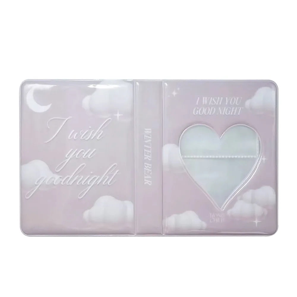 A clear pink photocard album with a winter bear design and a heart-shaped window.