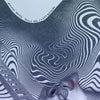 Album cover art for Mitski's first love late spring featuring swirling lines and a close-up of a face.