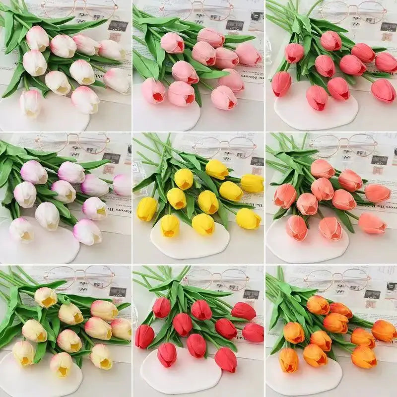 A collection of realistic artificial tulips in various shades of pink, white, and yellow arranged for home or wedding decor.