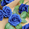 A close-up of artificial blue roses and green leaves arranged in a cardboard box.