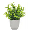 Lebendiges Kunstbonsai mit leuchtend grünem Laub in weißem Topf.