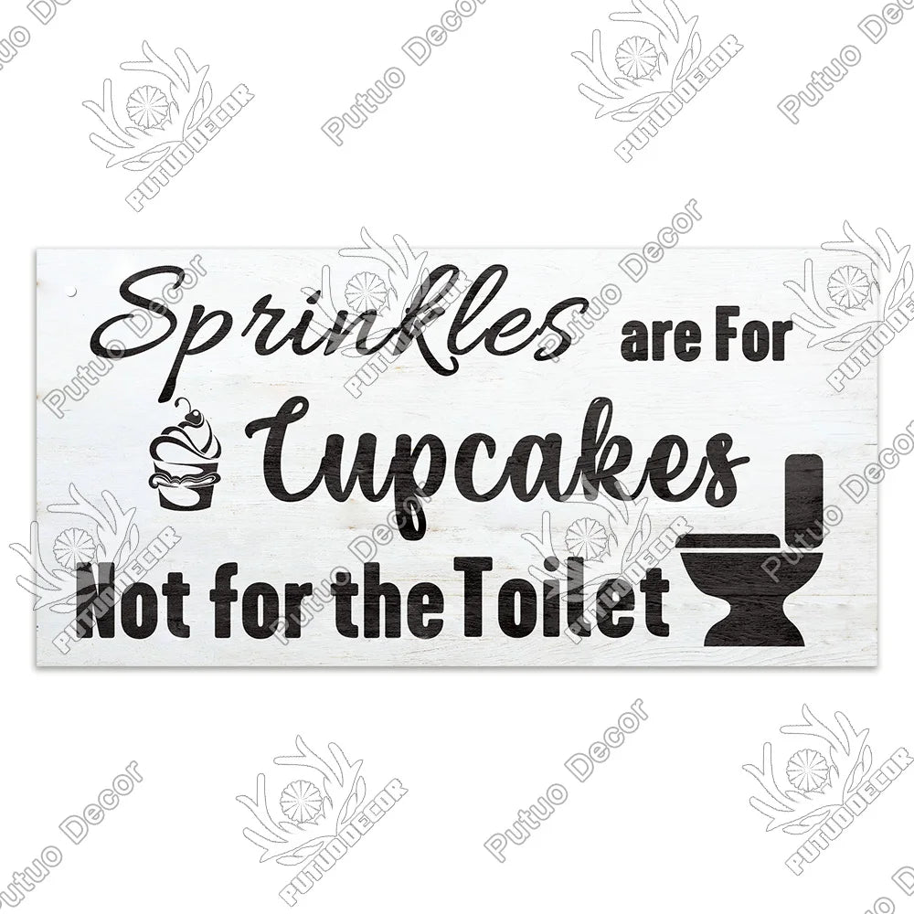 Rustic wooden sign with black text that reads Sprinkles are for cupcakes not for the toilet