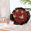A bouquet of deep red glitter roses arranged in a black decorative bowl for DIY decor.
