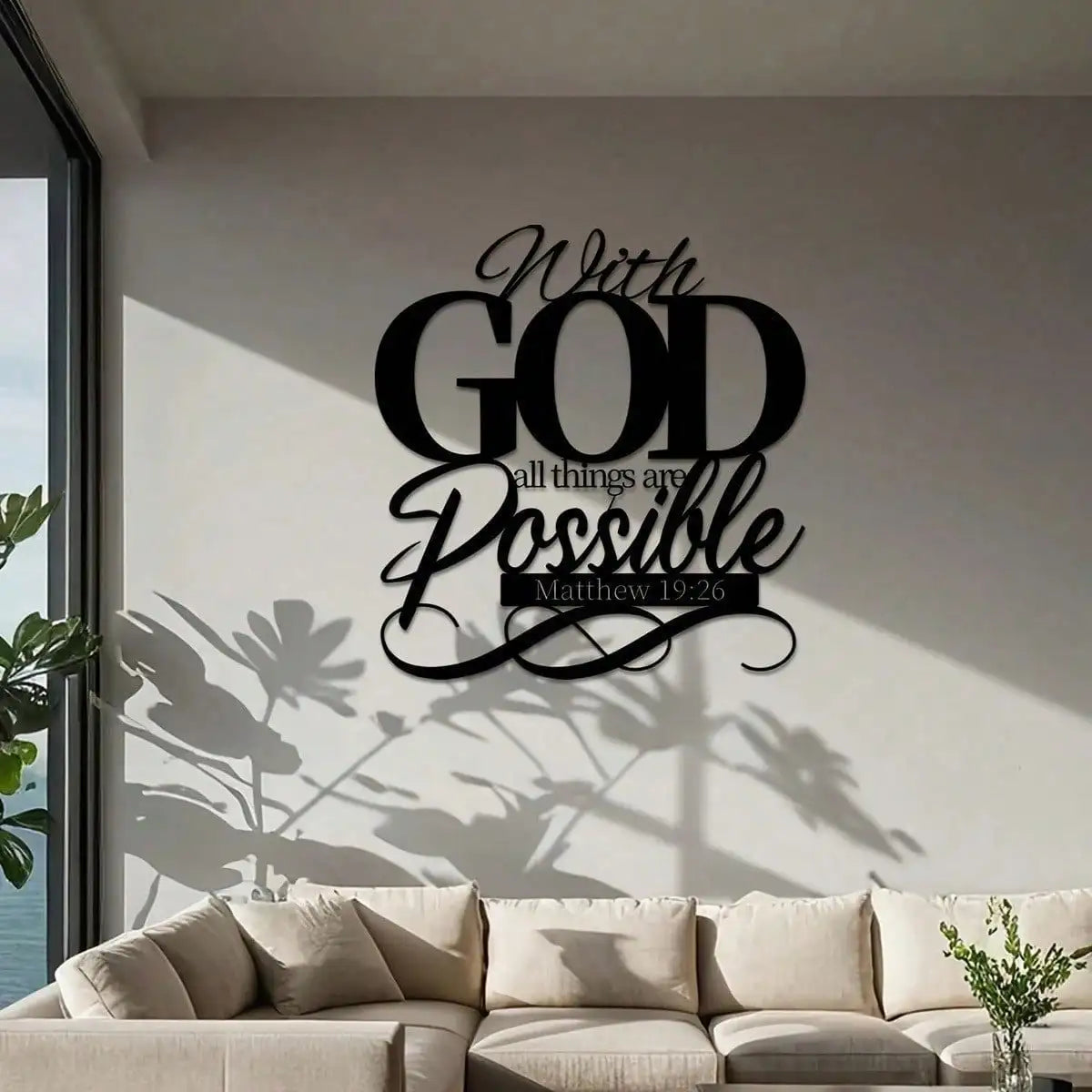 Black metal wall art featuring the Bible verse With God all things are possible from Matthew 19:26 on a white wall.