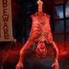 A realistic prop of a hanging corpse with blood and facial features for Halloween decor.
