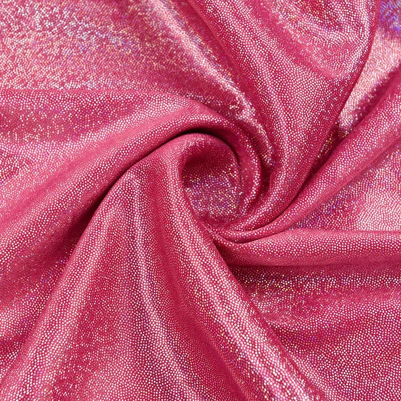 Crimson pink sequin fabric draped in a swirling fold for photography backdrop