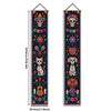 A vertical banner featuring a Mexican skull and floral motifs for a Day of the Dead theme.