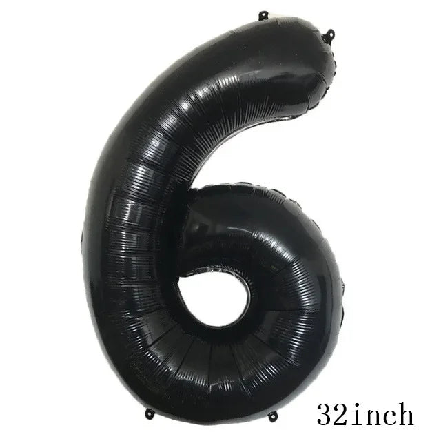 A black inflatable number six balloon used for party decorations.