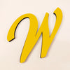 A yellow 3D acrylic letter W wall sticker against a light background.