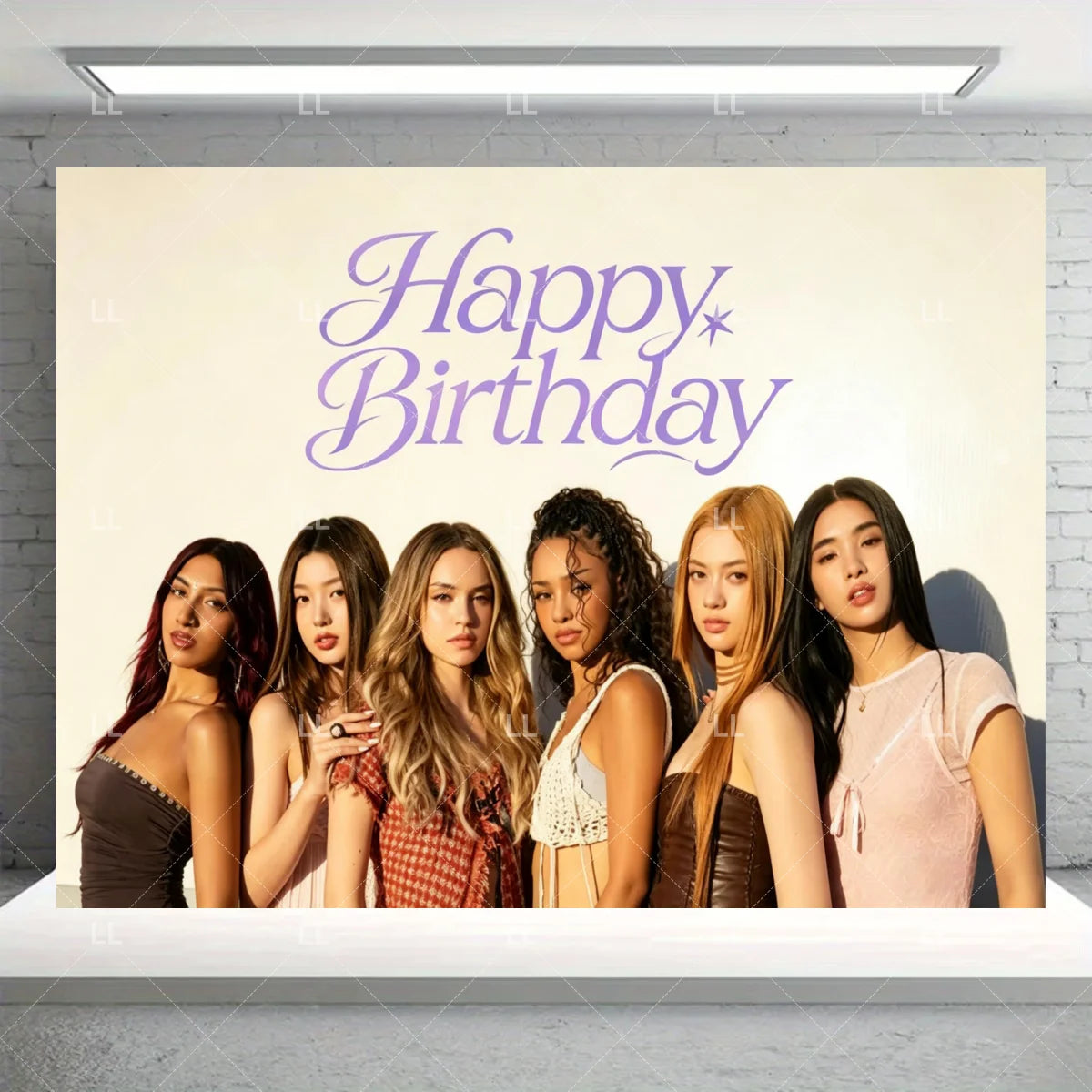 A group of five young women posing in front of a light-colored backdrop with purple text that reads Happy Birthday