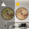 A minimalist round wall clock showing both day and night views with a sun and moon icon.