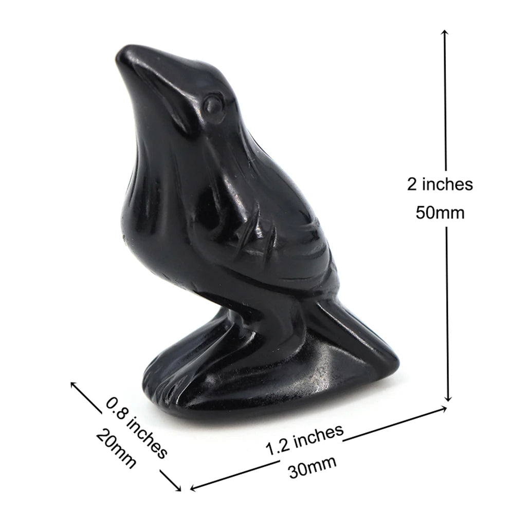 Estatua de obsidiana negra de un cuervo en perfil con dimensiones listadas.