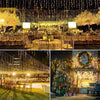 Outdoor decor featuring strings of solar LED icicle lights hanging above a seated event area.