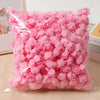 Una bolsa de flores de espuma artificial en forma de rosas rosas.
