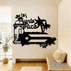 A black silhouette wall hanging featuring the text Puerto Rico and palm trees on a white wall.