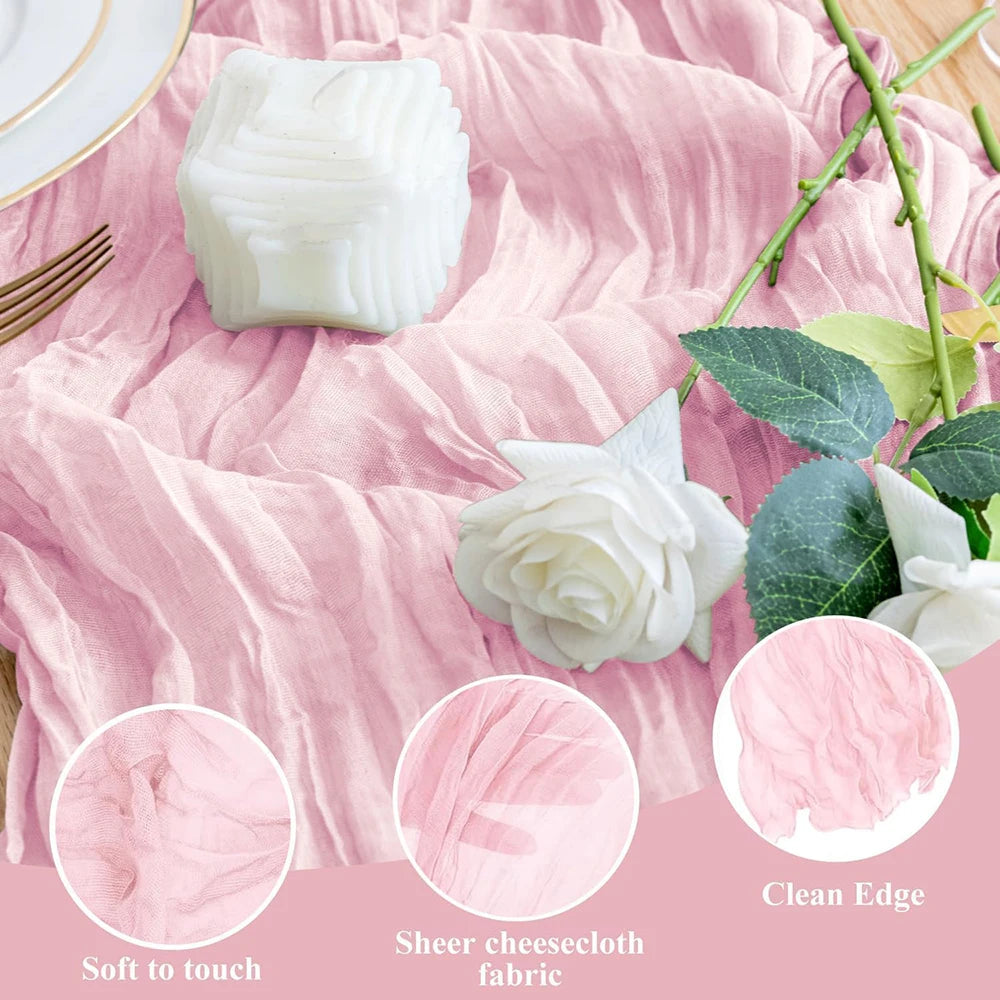A white cheesecloth block and a white rose flower displayed on a rustic pink fabric background.