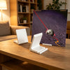 A white minimalist vinyl record and CD display stand resting on a wooden table next to a potted plant.