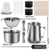 A complete candle making kit showing a melting pot, pouring pitcher, and various tools like silicone strands and measuring sp