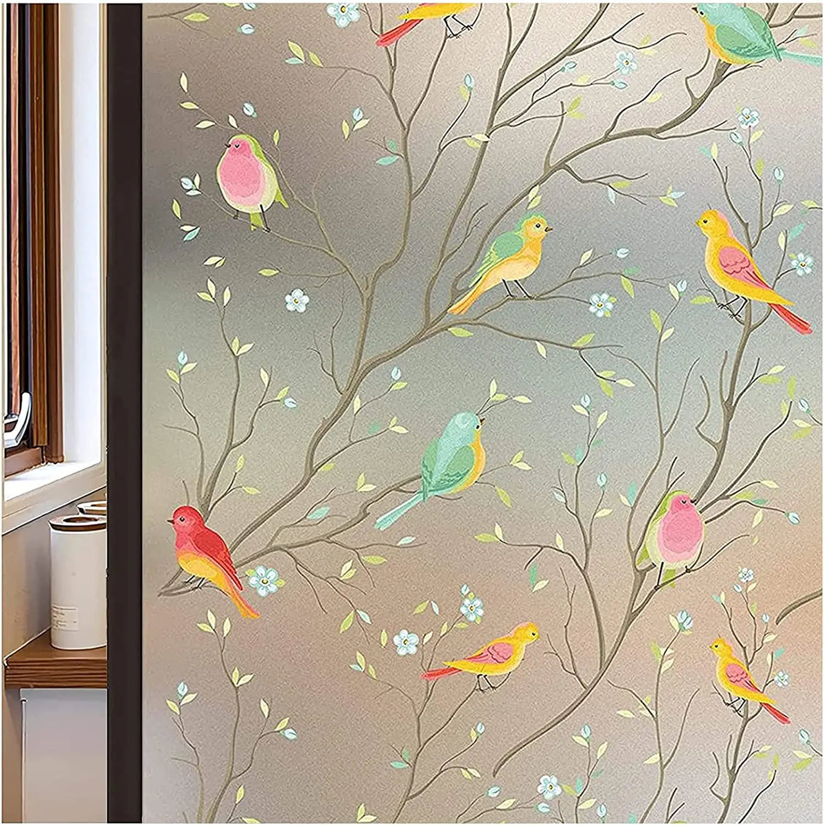 A close-up of frosted window privacy film featuring delicate watercolor illustrations of various small birds on tree branches