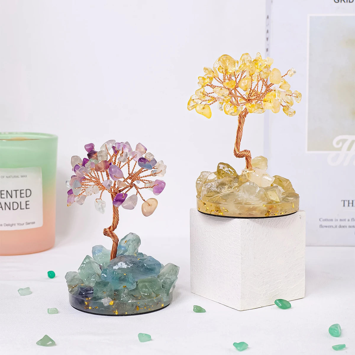 A small crystal tree featuring purple and yellow quartz crystals used as home decor.
