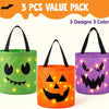 Un jeu de trois seaux à bonbons d'Halloween lumineux vert, orange et violet.