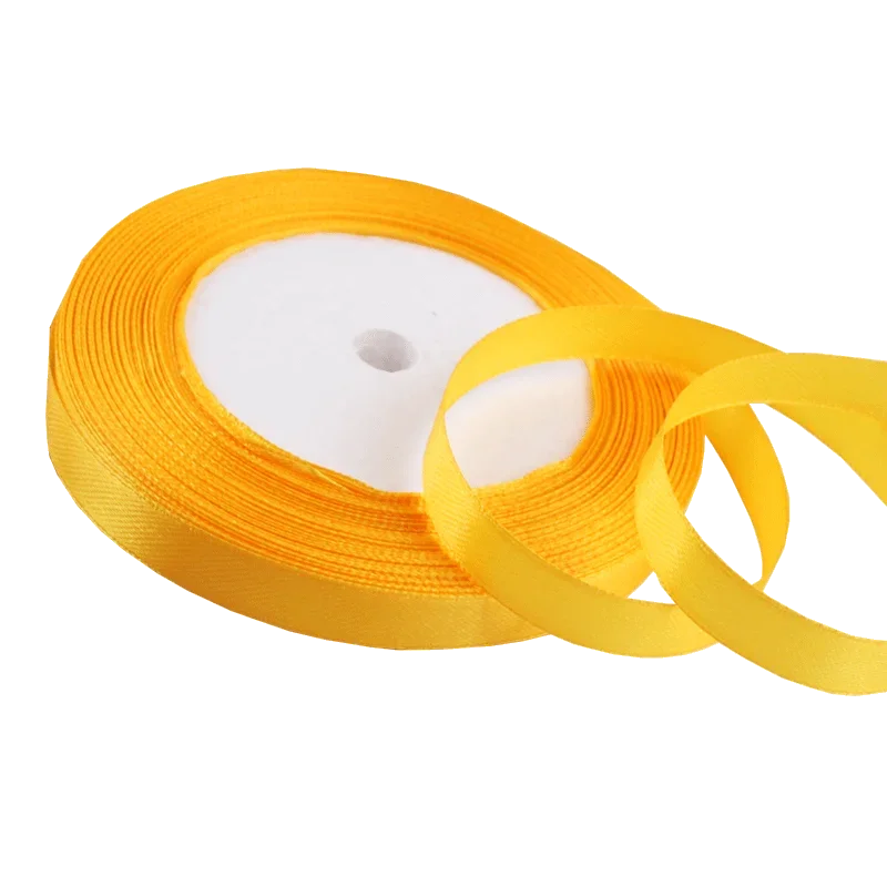 Roll of gold yellow satin ribbon for crafts and gift wrapping