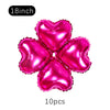 A set of ten metallic pink heart-shaped foil balloons for party decoration.