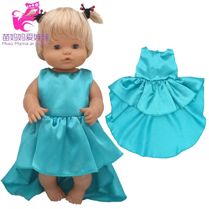 A blonde doll wearing a teal satin dress and matching ruffled skirt with a small hat.
