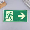 A rectangular photoluminescent emergency exit sign decal with a white figure running and an arrow pointing right on a green b