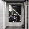 A framed canvas print featuring a black and white photo of Lionel Messi in a football jersey.