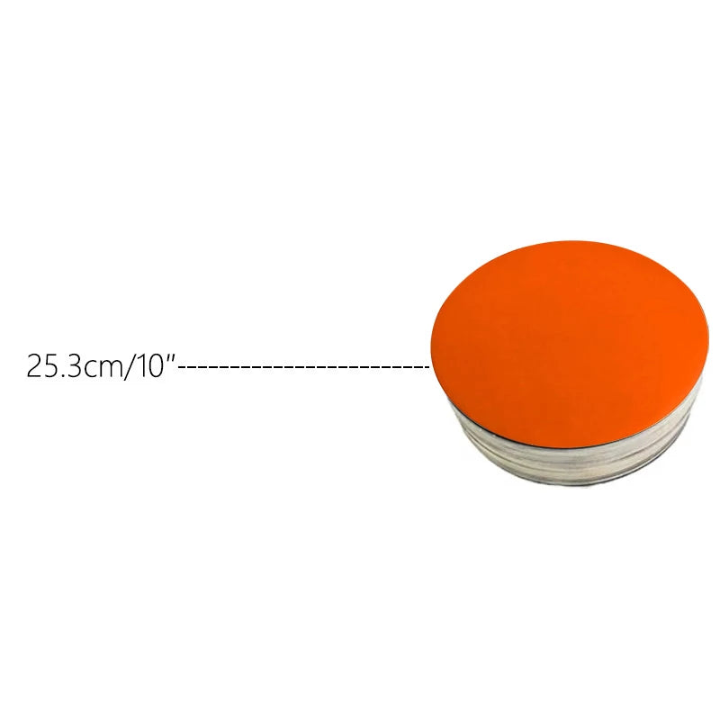 Round orange cardboard cake board with a measurement line indicating 25.3cm or 10 inches.