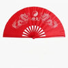 Red traditional bamboo folding fan decorated with dragons and a yin-yang symbol