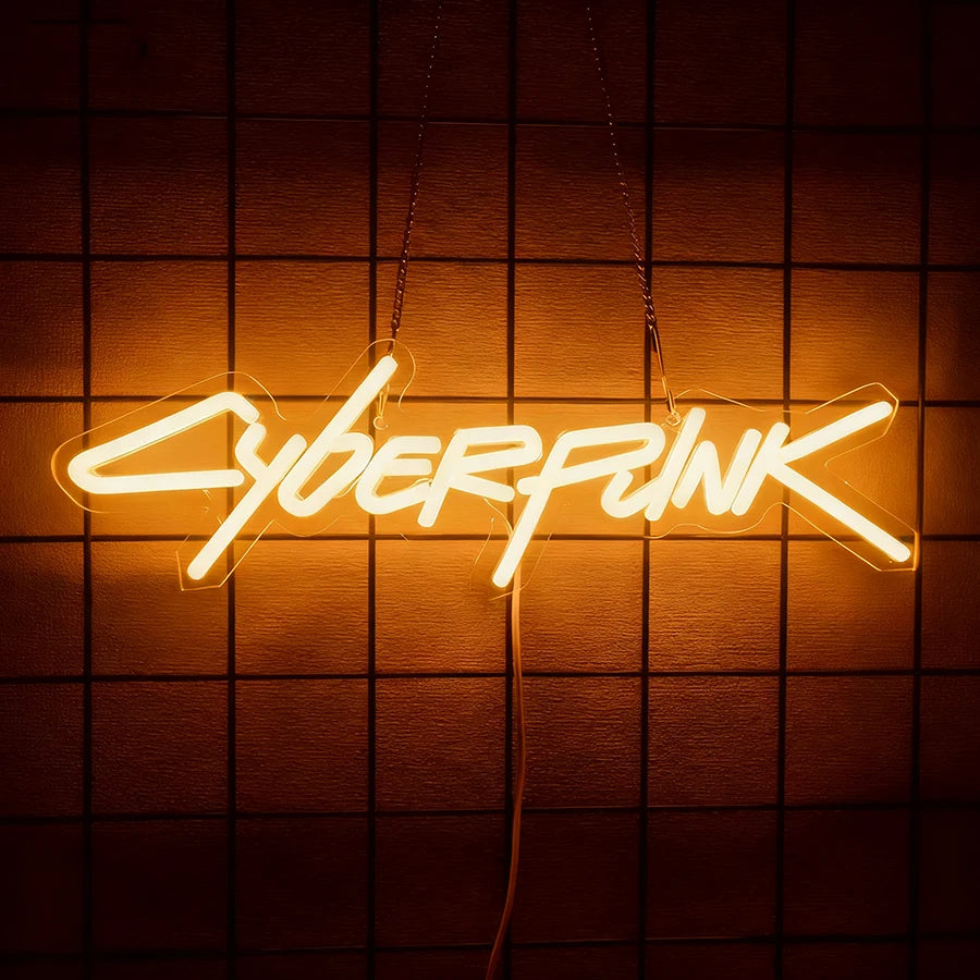 A glowing neon sign spelling out CYBERPUNK is suspended against a dark, grid-patterned wall.