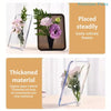 A clear acrylic frame flower vase holding purple and pink flowers.