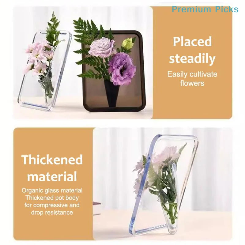 A clear acrylic frame flower vase holding purple and pink flowers.
