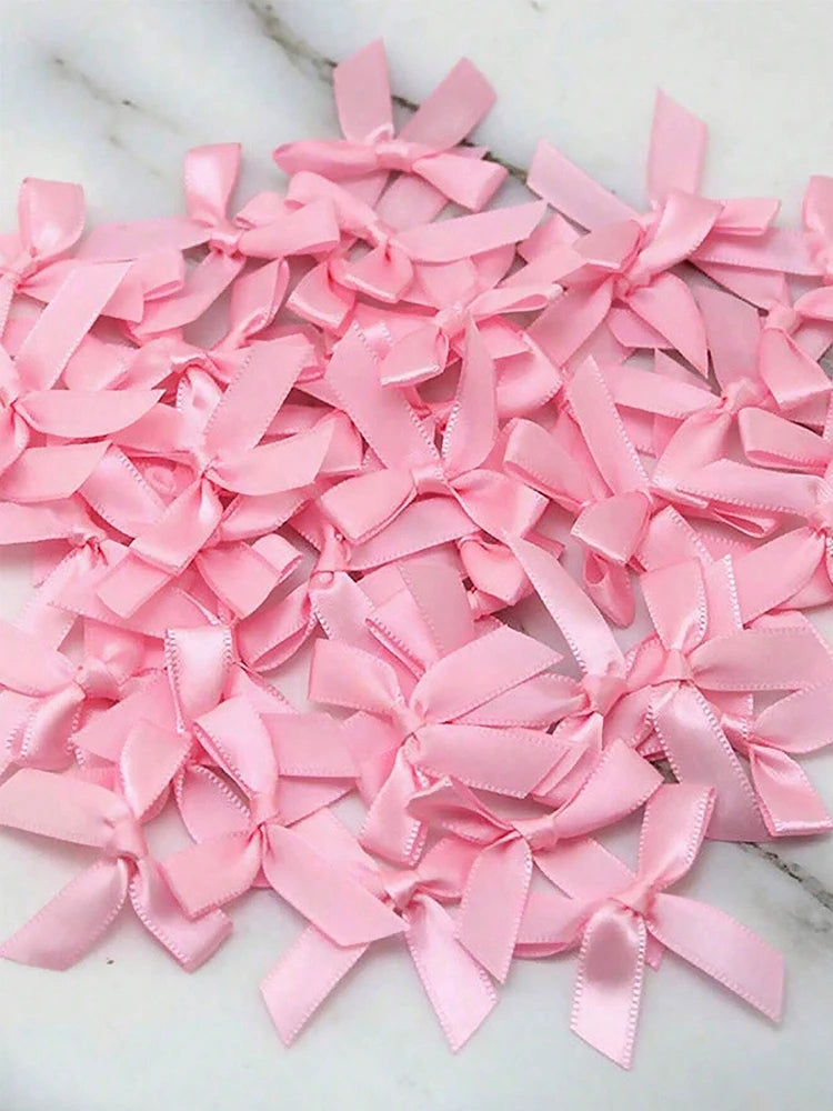 Pink satin ribbon bows for a princess birthday banner balloon set